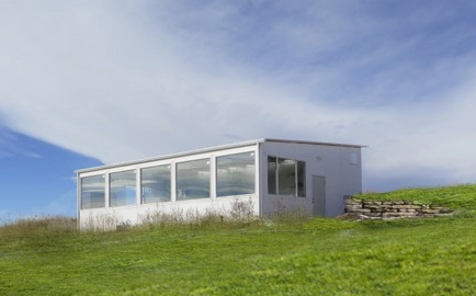 solar greenhouse on hillside