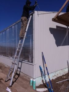 worker on greenhouse